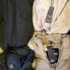 The photo shows a package with clothing in the category TJ.