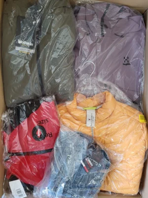 The photo shows a package with clothing in the category AJS.