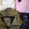 The photo shows a package with clothing in the category TJ.