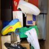 The photo shows a package with footwear in the category CS.
