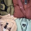 The photo shows a package with clothing in the category TJ.