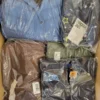 The photo shows a package with clothing in the category AJS.