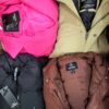The photo shows a package with clothing in the category TJ.