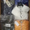 The photo shows a package with clothing in the category AJS.