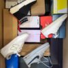 The photo shows a package with footwear in the category CS.