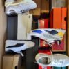 The photo shows a package with footwear in the category CS.
