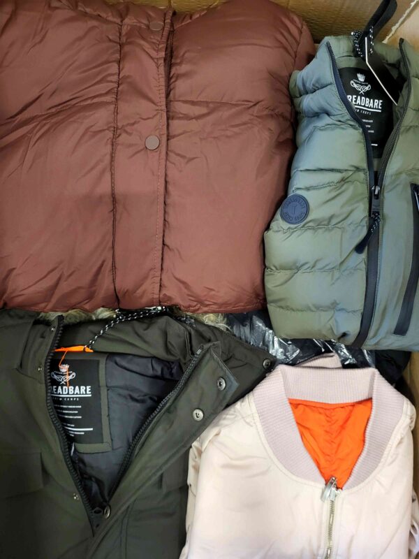 The photo shows a package with clothing in the category TJ.
