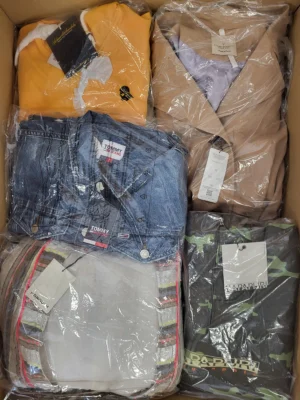 The photo shows a package with clothing in the category AJS.