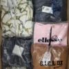 The photo shows a package with clothing in the category AJS.
