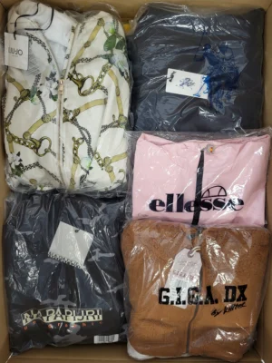 The photo shows a package with clothing in the category AJS.