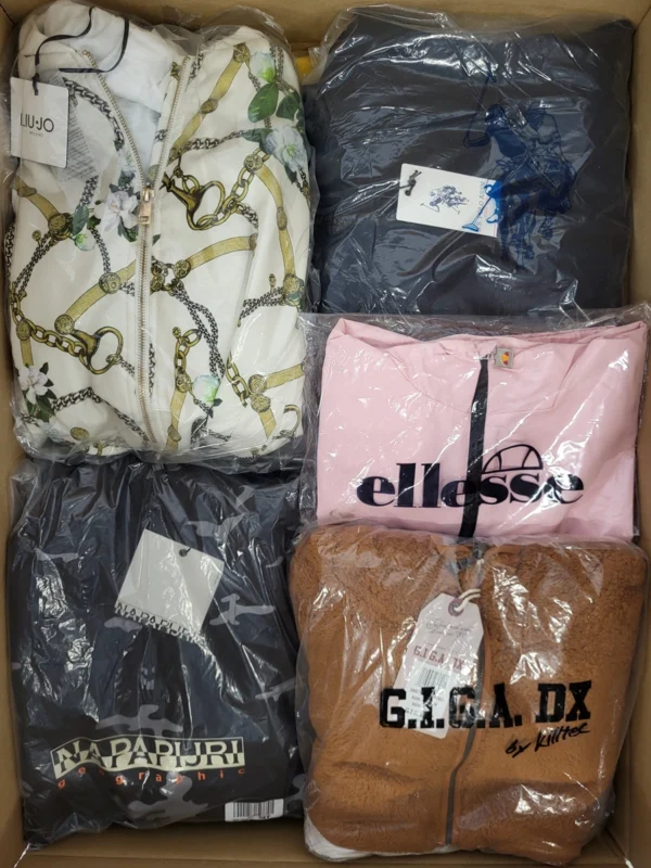 The photo shows a package with clothing in the category AJS.