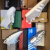 The photo shows a package with footwear in the category CS.