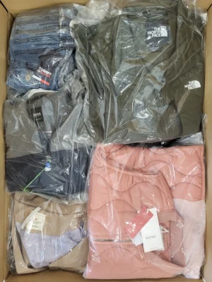 The photo shows a package with clothing in the category AJS.