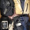 The photo shows a package with clothing in the category TJ.