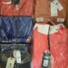 The photo shows a package with clothing in the category AJS.