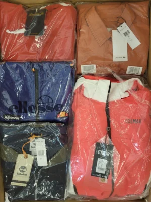 The photo shows a package with clothing in the category AJS.