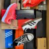 The photo shows a package with footwear in the category CS.