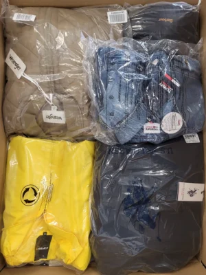 The photo shows a package with clothing in the category AJS.