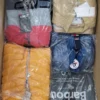 The photo shows a package with clothing in the category AJS.