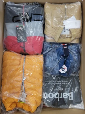 The photo shows a package with clothing in the category AJS.