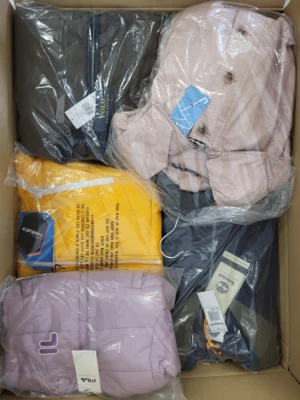 The photo shows a package with clothing in the category AJS.