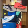 The photo shows a package with footwear in the category CS.