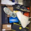 The photo shows a package with footwear in the category CS.