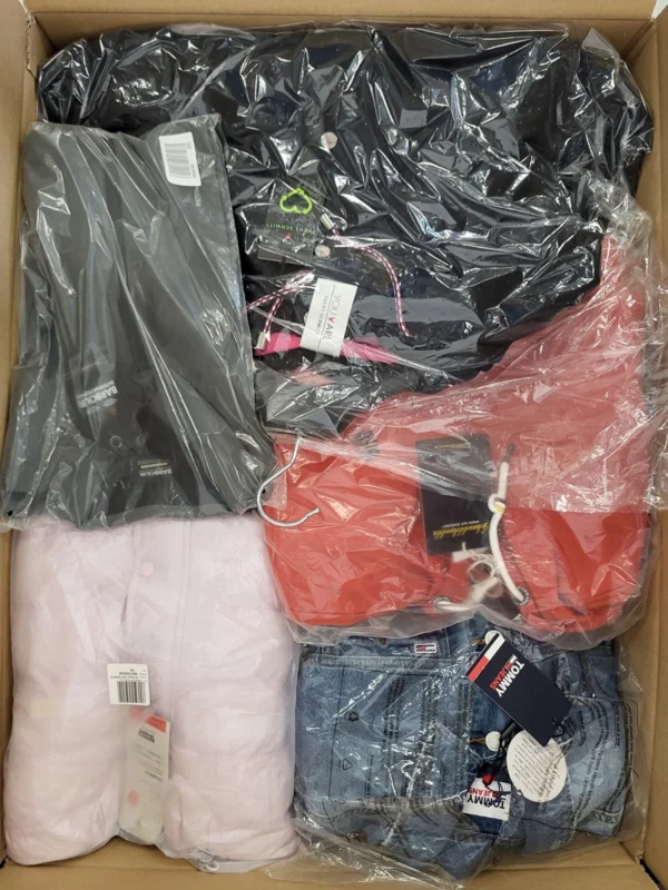 The photo shows a package with clothing in the category AJS.