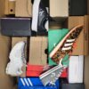 The photo shows a package with footwear in the category CS.