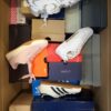 The photo shows a package with footwear in the category CS.