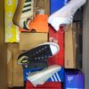 The photo shows a package with footwear in the category CS.