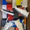 The photo shows a package with footwear in the category CS.