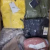 The photo shows a package with clothing in the category AJS.