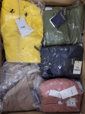 The photo shows a package with clothing in the category AJS.