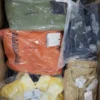 The photo shows a package with clothing in the category AJS.
