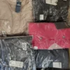 The photo shows a package with clothing in the category AJS.