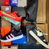 The photo shows a package with footwear in the category CS.
