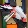 The photo shows a package with footwear in the category CS.