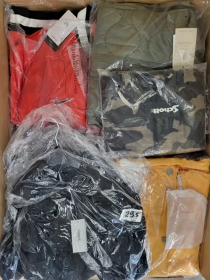 The photo shows a package with clothing in the category AJS.