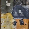 The photo shows a package with clothing in the category AJS.