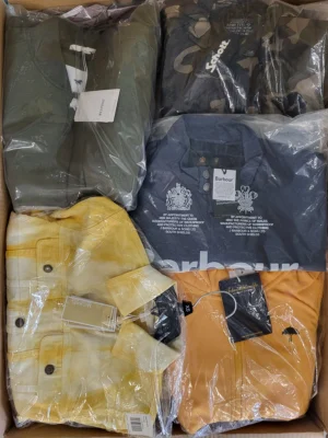 The photo shows a package with clothing in the category AJS.