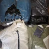The photo shows a package with clothing in the category AJS.