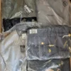 The photo shows a package with clothing in the category AJS.