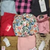 The photo shows a package with clothing in the category TSC.