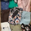 The photo shows a package with clothing in the category TSC.