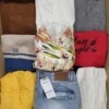 The photo shows a package with clothing in the category TSC.