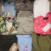 The photo shows a package with clothing in the category TSC.