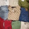 The photo shows a package with clothing in the category TSC.
