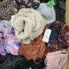 The photo shows a package with clothing in the category TSC.