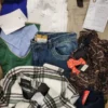 The photo shows a package with clothing in the category TSC.
